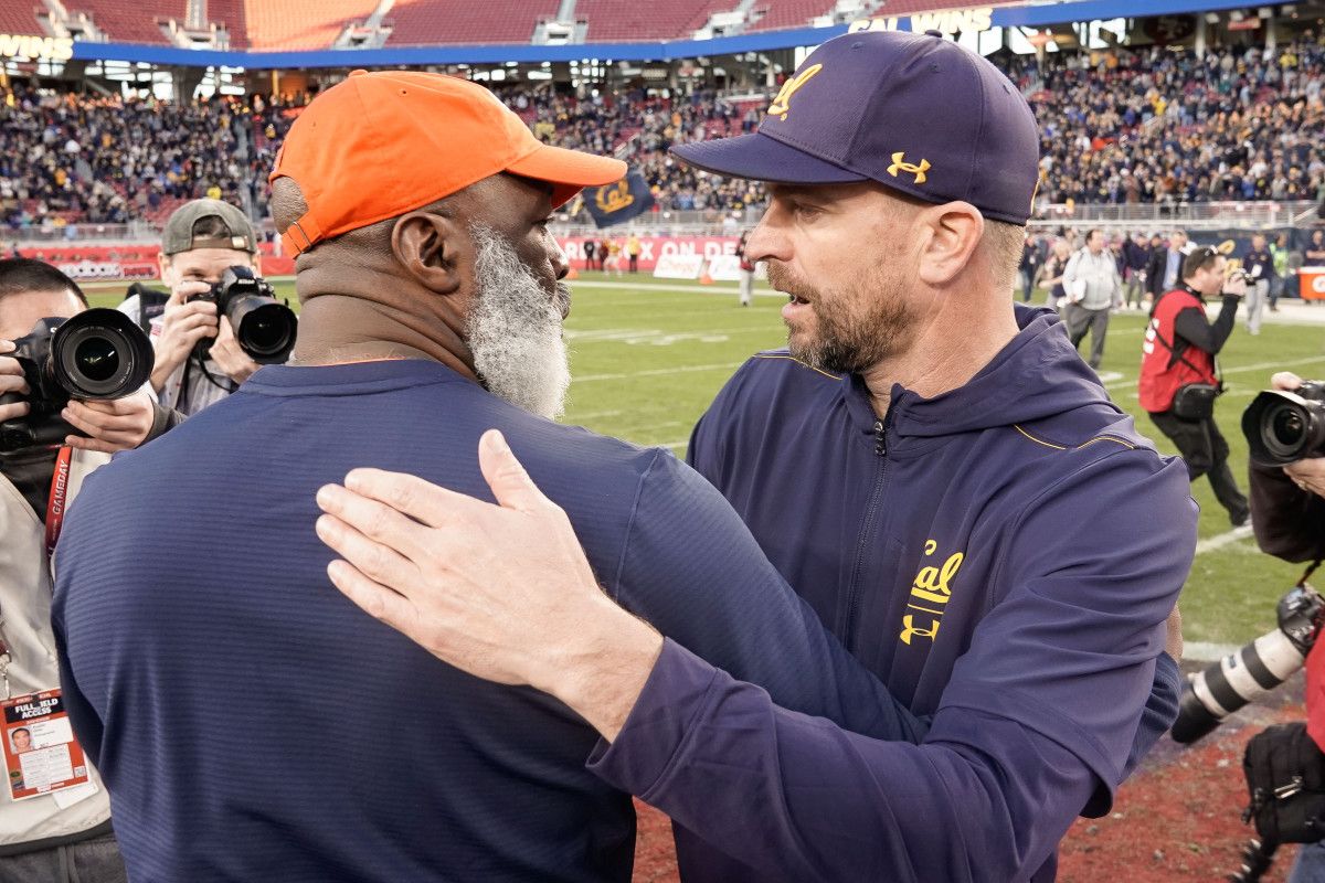 Illinois Fighting Illini head coach Lovie Smith (left) and California Golden Bears head coach Justin Wilcox after the game at Levi's Stadium.