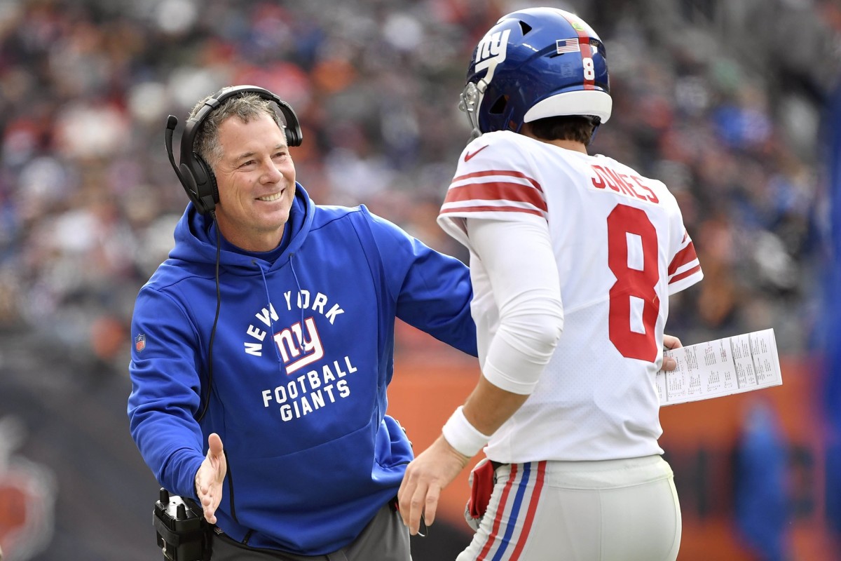 Nov 24, 2019; Chicago, IL, USA; New York Giants head coach Pat Shurmur congratulates New York Giants quarterback Daniel Jones (8) for his touchdown in the first half against the Chicago Bears at Soldier Field.