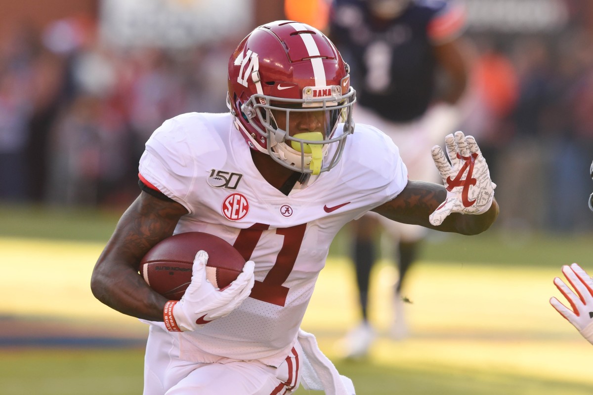 Alabama Crimson Tide wide receiver Henry Ruggs III (11) runs the ball during the first quarter against the Auburn Tigers at Jordan-Hare Stadium.