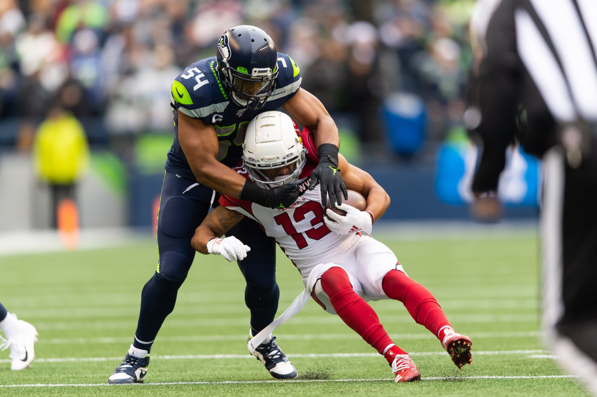 Seattle Seahawks middle linebacker Bobby Wagner (54) tackles Arizona Cardinals wide receiver Christian Kirk (13) during the first half at CenturyLink Field. Arizona defeated Seattle 27-13.