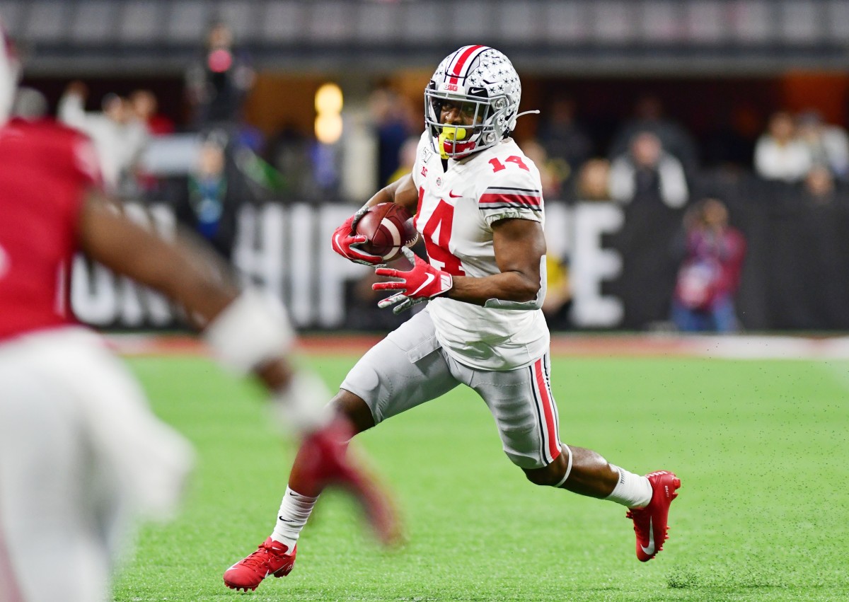 Ohio State Buckeyes receiver K.J. Hill Jr. (14) runs to the outside against the Wisconsin Badgers during the first half in the 2019 Big Ten Championship Game at Lucas Oil Stadium.