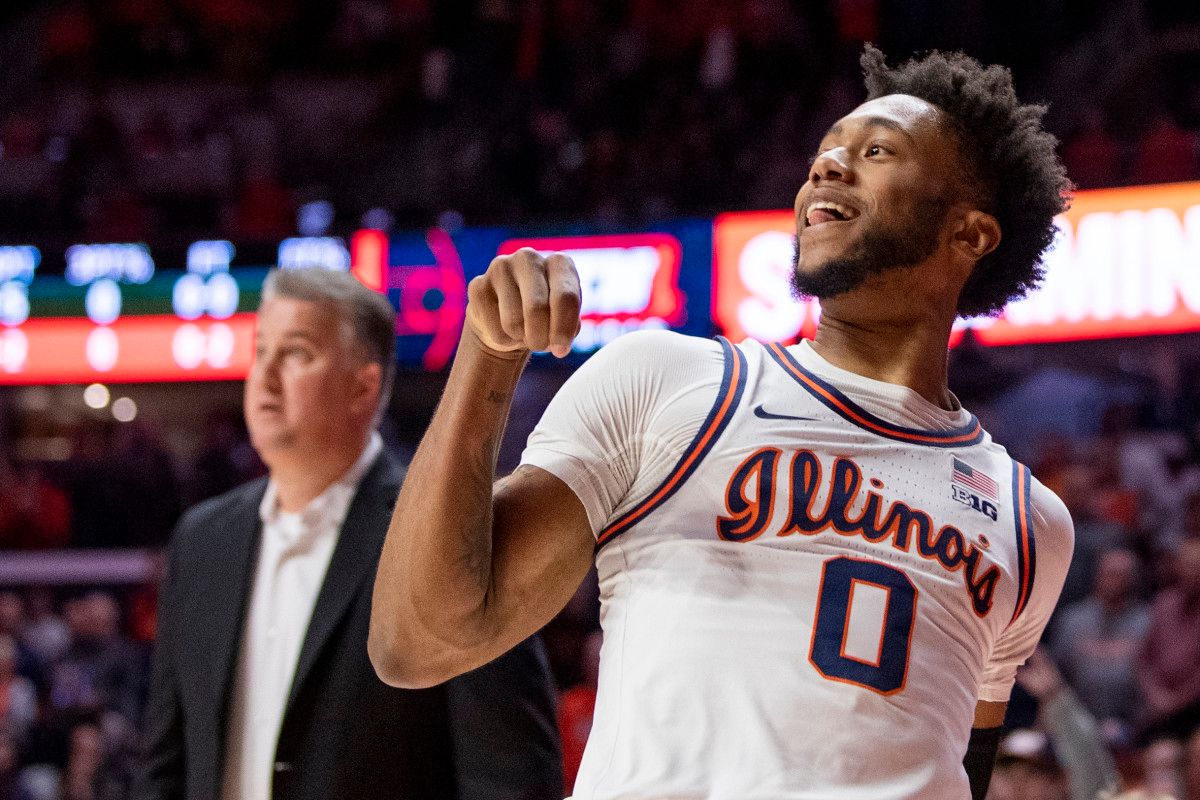 Illinois Fighting Illini guard Alan Griffin (0) watches his three-point shot as Purdue Boilermakers head coach Matt Painter looks on during the first half at State Farm Center.