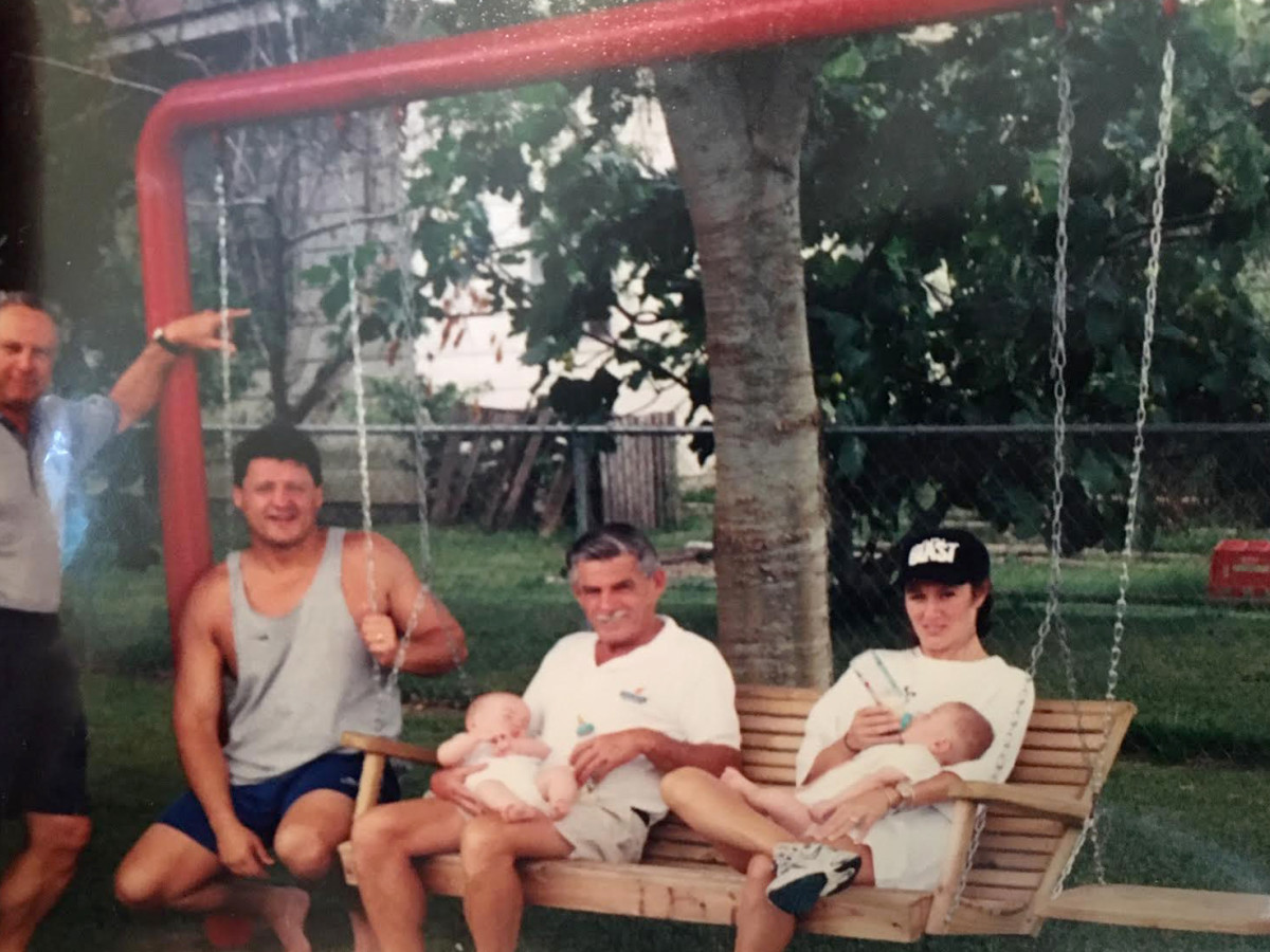 Edward Orgeron Sr. was known for sitting on his front-yard swing. He's pictured here with Edward Jr., wife Kelly and their two twin boys, Parker and Cody.