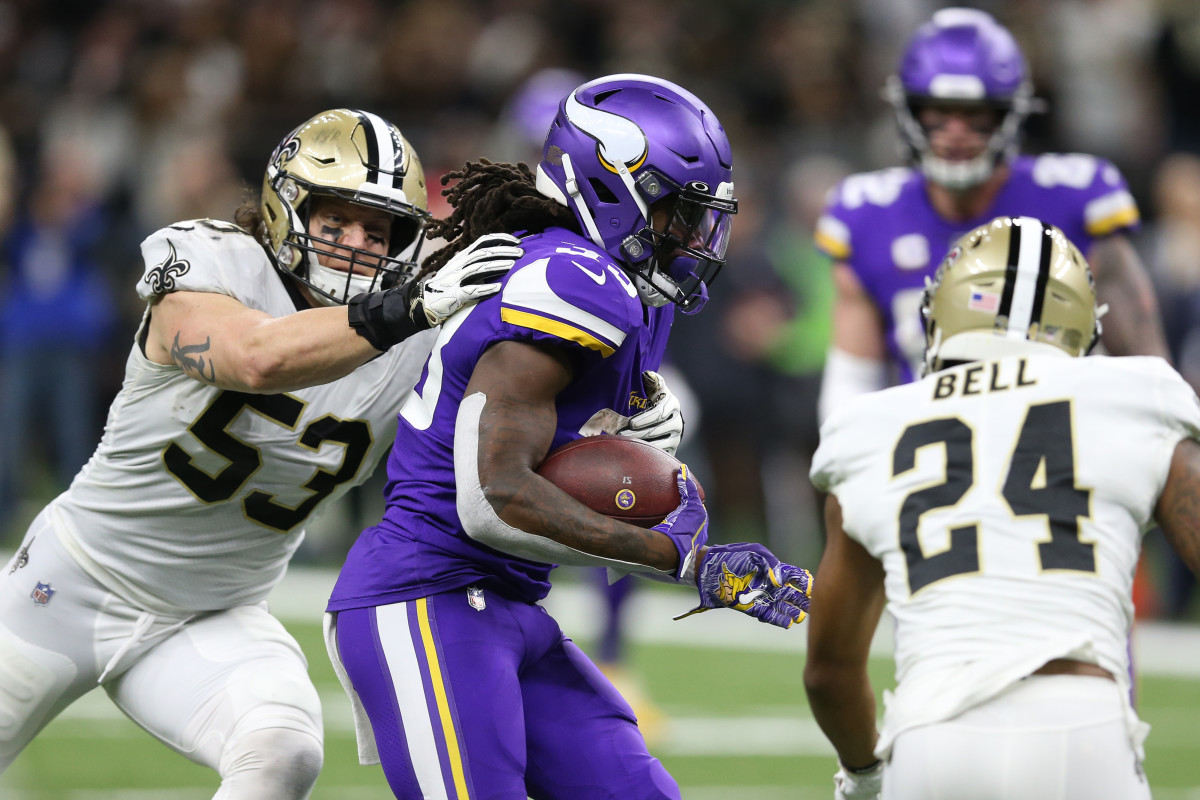 Jan 5, 2020; New Orleans, Louisiana, USA; Minnesota Vikings running back Dalvin Cook (33) runs the ball against New Orleans Saints outside linebacker A.J. Klein (53) and strong safety Vonn Bell (24) during the second quarter of a NFC Wild Card playoff football game. Mandatory Credit: Chuck Cook -USA TODAY Sports