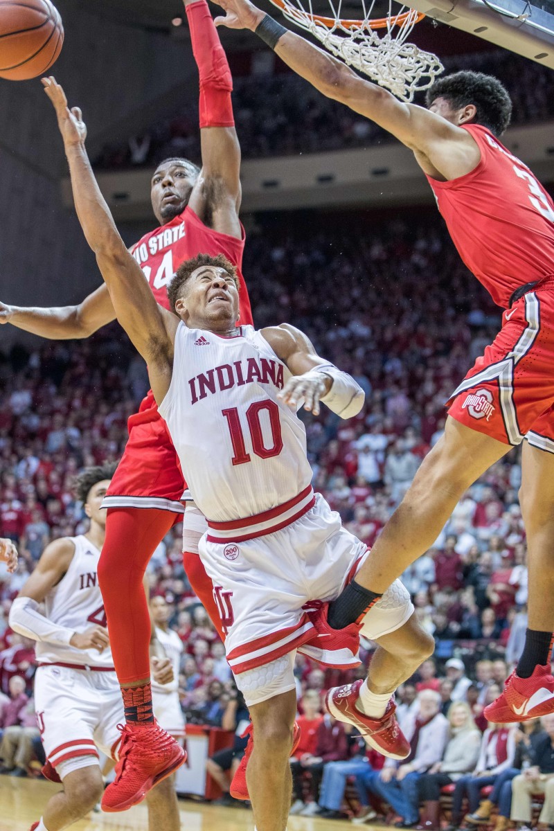Bloomington, Indiana, USA; Indiana Hoosiers guard Rob Phinisee (10) shoots the ball while Ohio State Buckeyes guard D.J. Carton (3) defends in the first half at Simon Skjodt Assembly Hall. Mandatory Credit: Trevor Ruszkowski-USA TODAY Sports