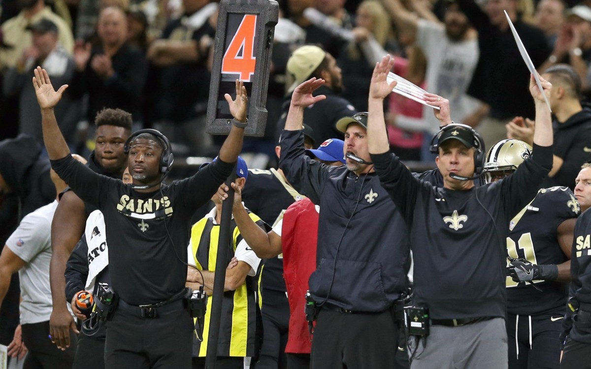 Jan 7, 2018; New Orleans, LA, USA; New Orleans Saints defensive secondary coach Aaron Glenn, left, and head coach Sean Payton gesture during the fourth quarter against the Carolina Panthers in the NFC Wild Card playoff football game at Mercedes-Benz Superdome.