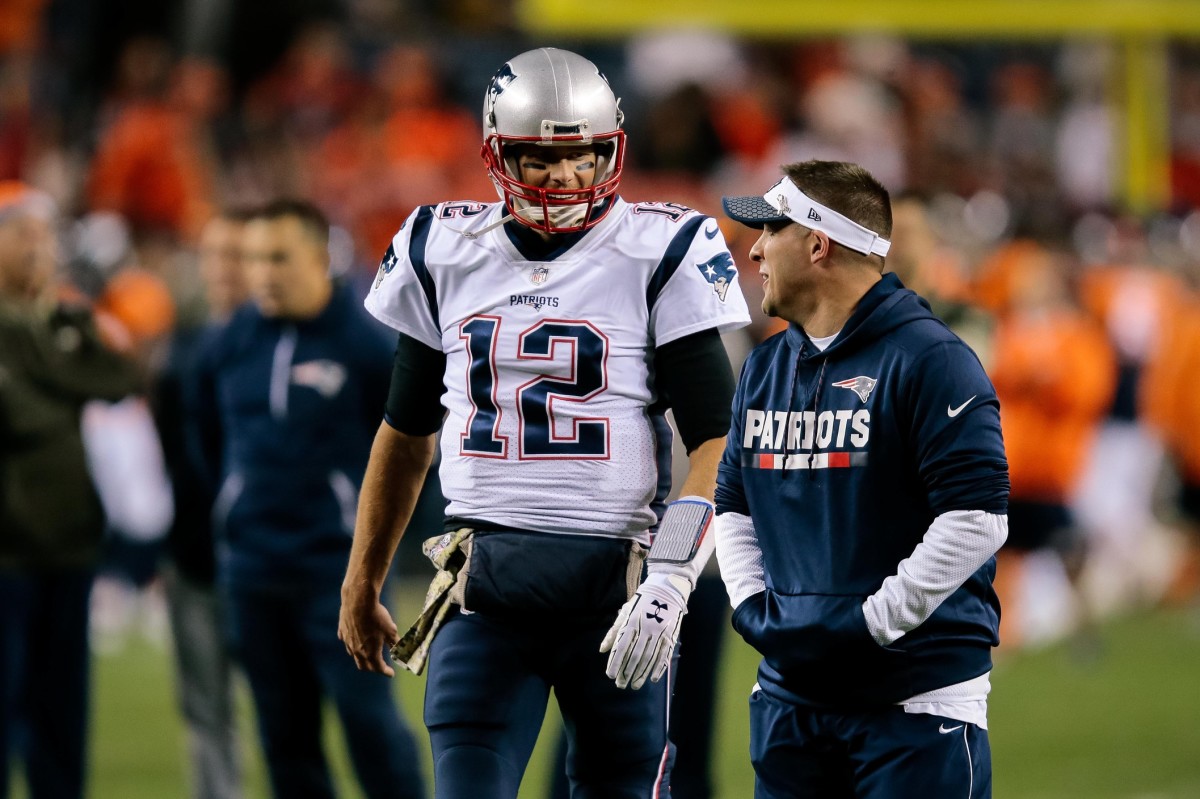 Nov 12, 2017; Denver, CO, USA; New England Patriots quarterback Tom Brady (12) talks with assistant quarterbacks coach Jerry Schuplinski before the game against the Denver Broncos at Sports Authority Field at Mile High. Mandatory Credit: Isaiah J. Downing-USA TODAY Sports