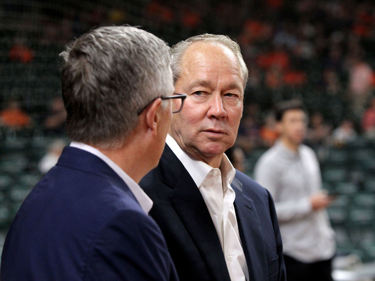 Astros owner Jim Crane (right) standing with former GM Jeff Luhnow (left).