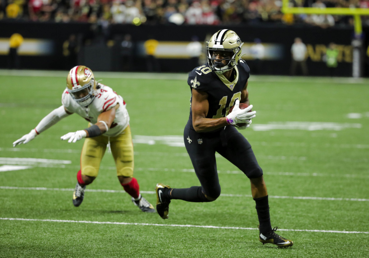 Dec 8, 2019; New Orleans, LA, USA; New Orleans Saints wide receiver Tre'Quan Smith (10) escapes a tackle attempt of San Francisco 49ers middle linebacker Fred Warner (54) on a touchdown during the fourth quarter at the Mercedes-Benz Superdome. Mandatory Credit: Derick E. Hingle-USA TODAY Sports