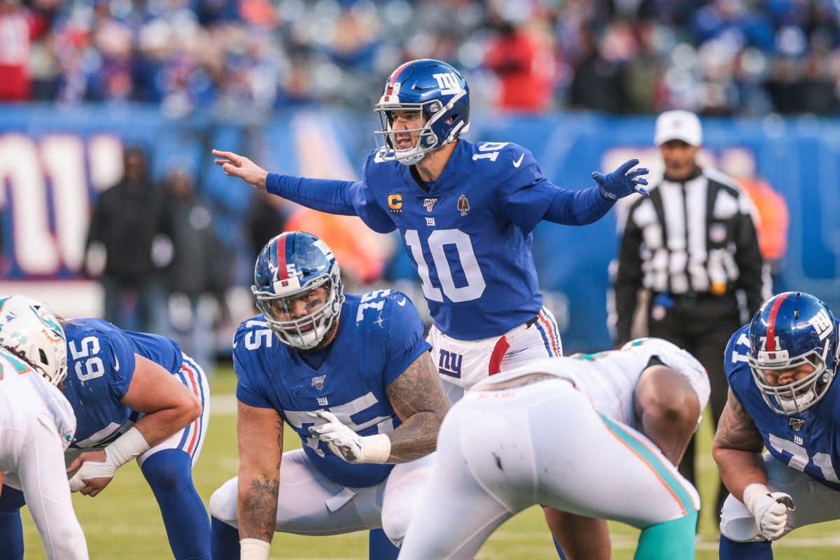 Dec 15, 2019; East Rutherford, NJ, USA; New York Giants quarterback Eli Manning (10) calls out signals as center Jon Halapio (75) waits to sea the ball during the second half against the Miami Dolphins at MetLife Stadium.