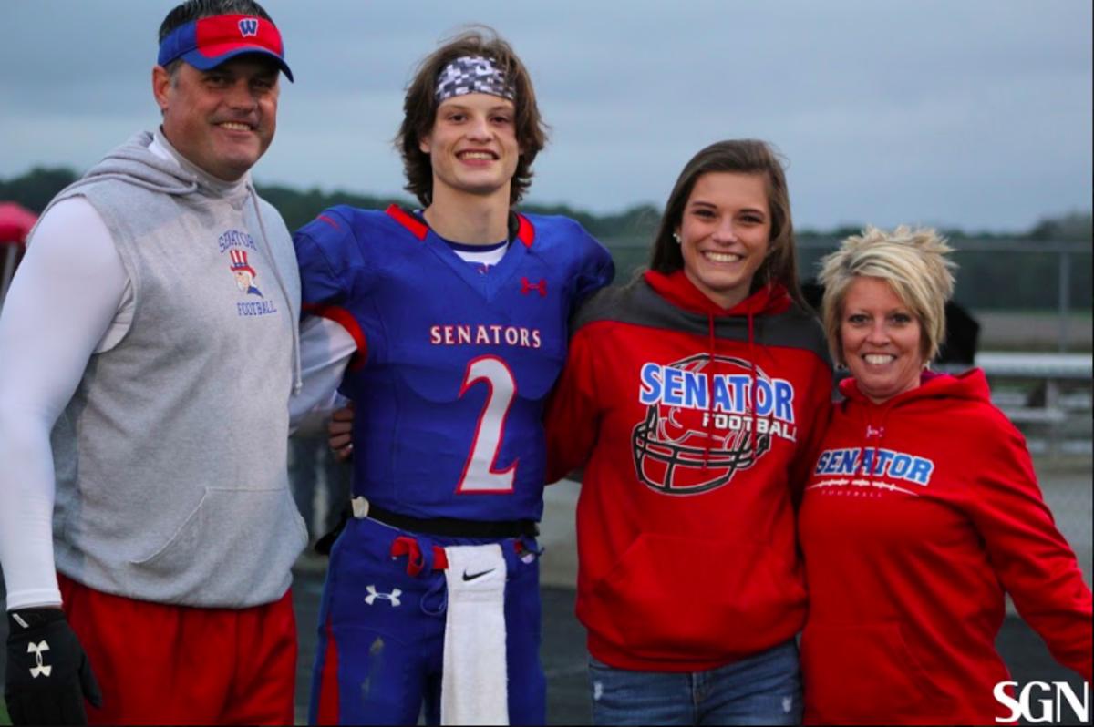 West Washington High School football coach Phillip Bowsman pictures with his son Holden, daughter Maddie and wife Beth earlier last year. (Photos courtesy of Samantha Nance.)