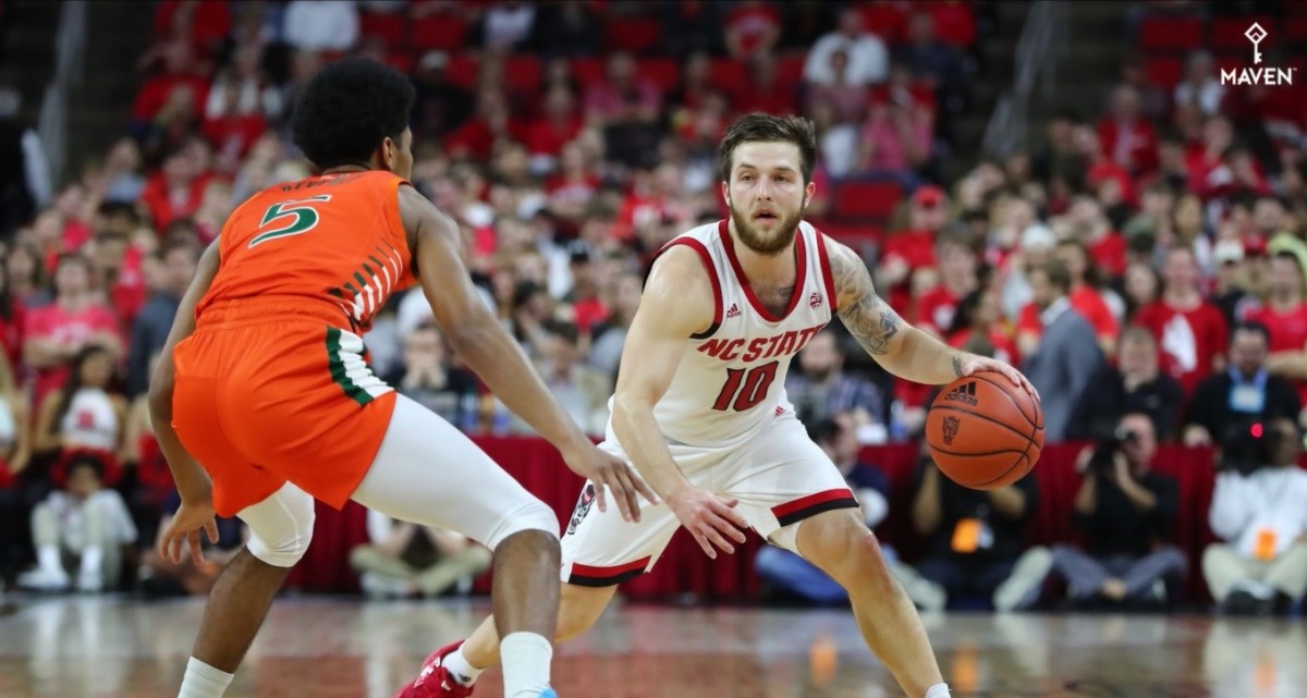 Head-to-head Beverlys ... NC State's Braxton Beverly works against Miami's Harlond Beverly