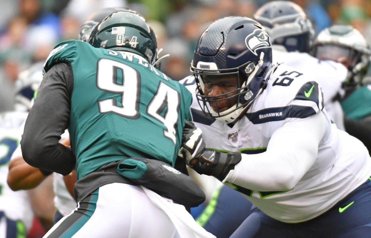 Seattle Seahawks offensive tackle Germain Ifedi (65) blocks Philadelphia Eagles defensive end Josh Sweat (94) at Lincoln Financial Field.