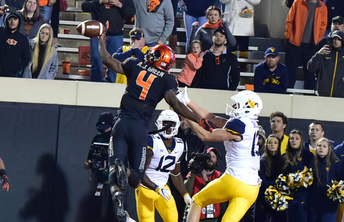 A.J. Green goes high to stop the pass and preserve a win over West Virginia.