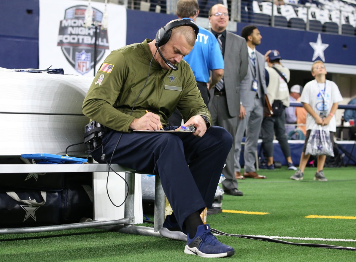 Nov 5, 2018; Arlington, TX, USA; Dallas Cowboys offensive line coach Marc Colombo sits on the bench prior to the game against the Tennessee Titans at AT&T Stadium.