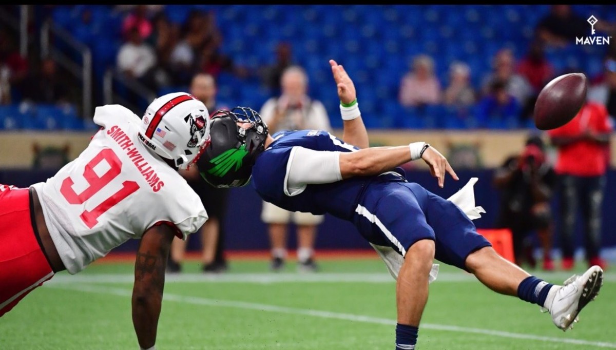 James Smith-Williams takes down North Texas quarterback Mason Fine during Saturday's East-West Shrine Bowl