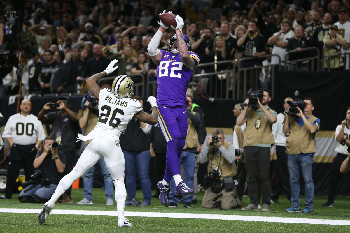 Jan 5, 2020; New Orleans, Louisiana, USA; Minnesota Vikings tight end Kyle Rudolph (82) catches a pass for the winning touchdown over New Orleans Saints cornerback P.J. Williams (26) during overtime of a NFC Wild Card playoff football game at the Mercedes-Benz Superdome. Mandatory Credit: Chuck Cook -USA TODAY Sports
