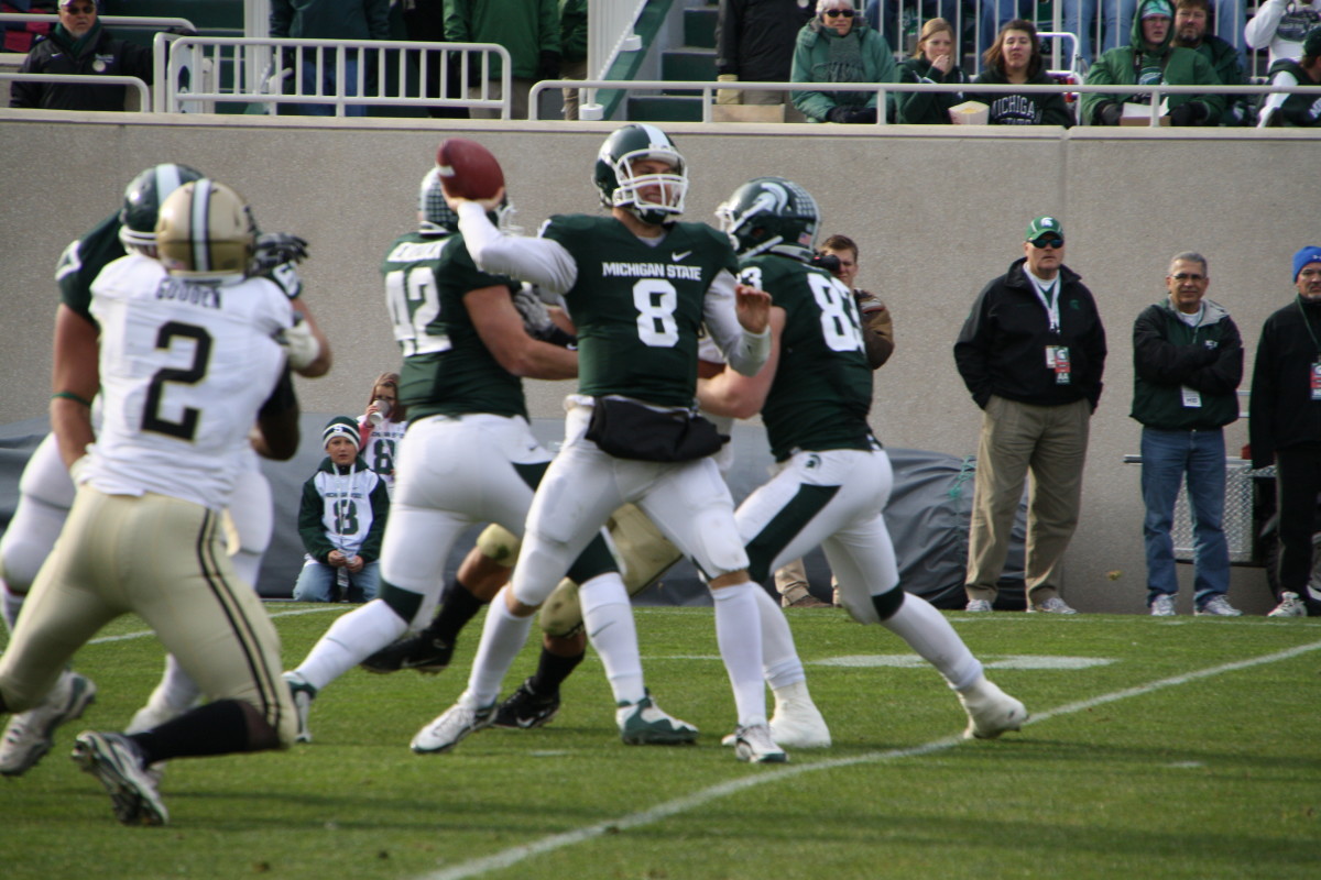 Injured and struggling to perform, like a warrior Kirk Cousins led the Spartans to victory.  Photo courtesy of Mark Boomgaard.