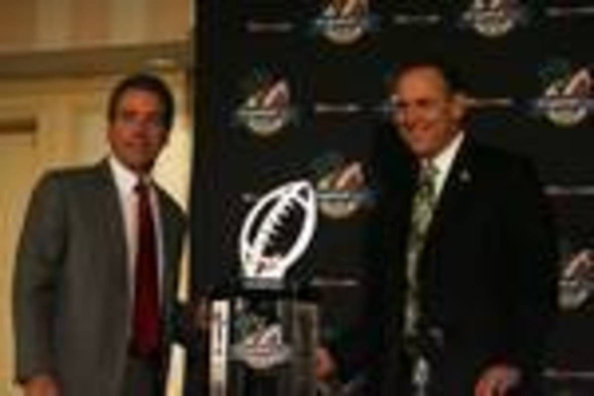 Mark Dantonio was all smiles and confident along side Nick Saban getting ready for the Capital One Bowl. Photo courtesy of Bill Marklevits.