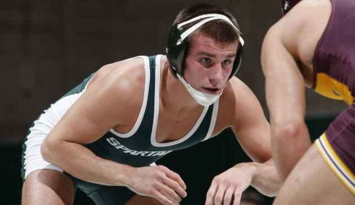 No. 20 Dan Osterman records a 7-4 decision over No. 10 Cole Schmitt at 149 pounds. Photo courtesy of MSU SID.