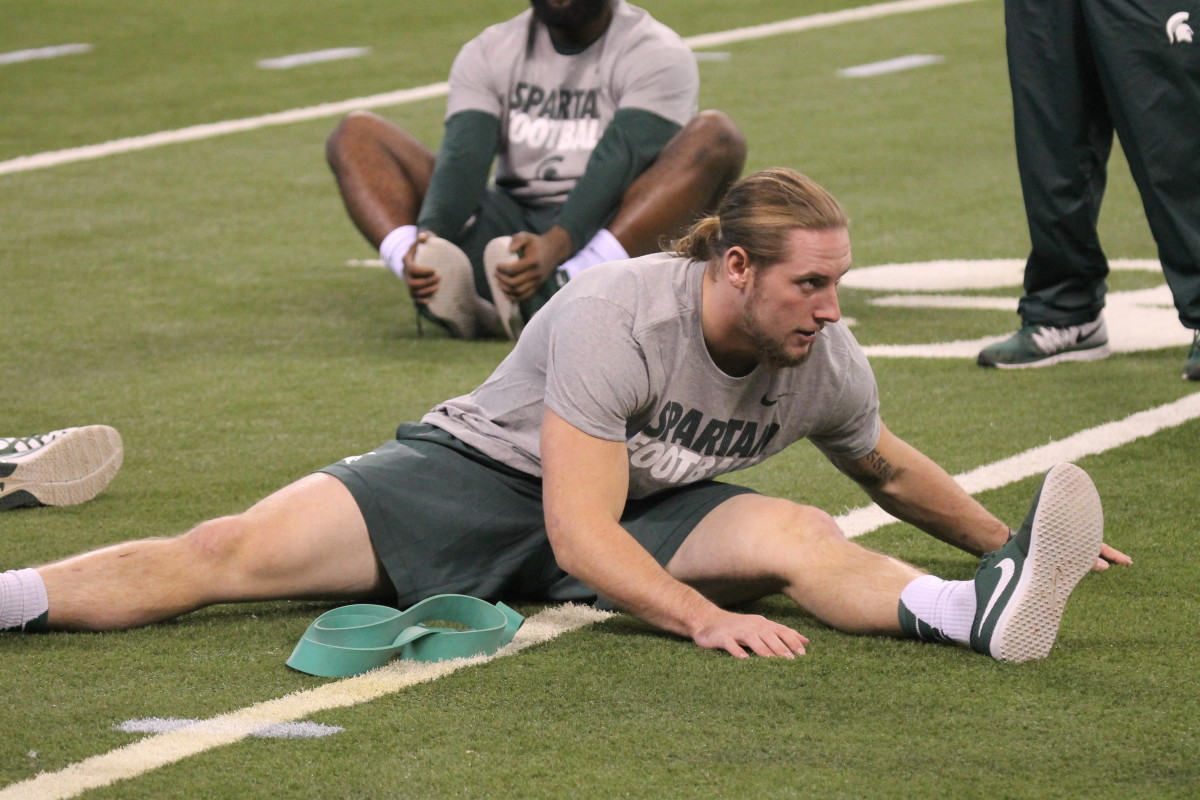 Riley Bullough warms up prior to the 2015 B1G Championship game.