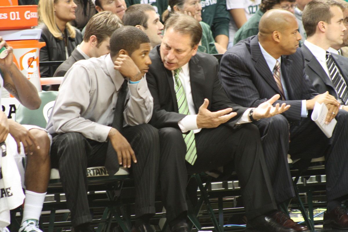 Tom Izzo took time tonight during the game to coach his suspended star guard Korie Lucious. Photo courtesy of Mark Boomgaard.