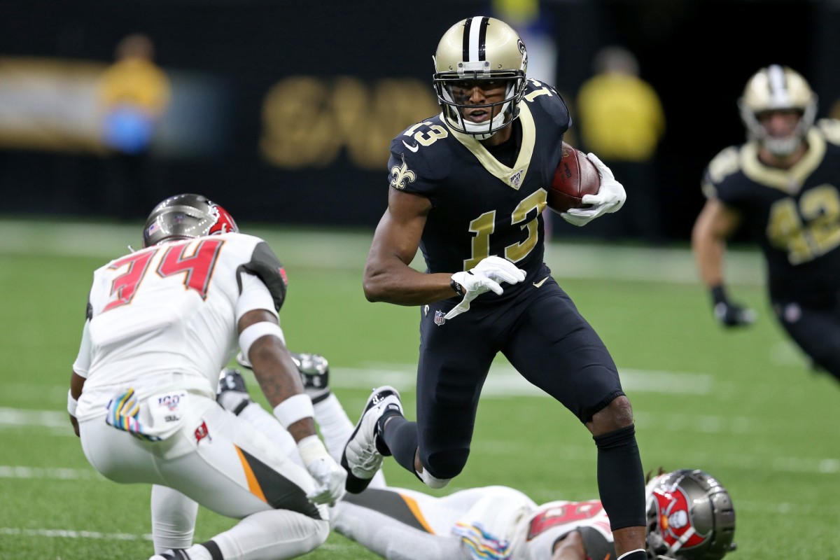 Oct 6, 2019; New Orleans, LA, USA; New Orleans Saints wide receiver Michael Thomas (13) runs the ball against Tampa Bay Buccaneers safety Mike Edwards (34) in the second quarter at the Mercedes-Benz Superdome. Mandatory Credit: Chuck Cook-USA TODAY Sports