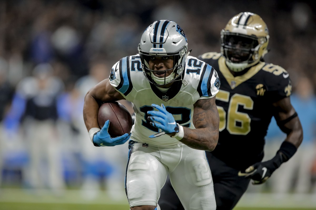 Dec 30, 2018; New Orleans, LA, USA; Carolina Panthers wide receiver DJ Moore (12) runs after a catch against the New Orleans Saints linebacker Demario Davis (56) during the first quarter at the Mercedes-Benz Superdome. Mandatory Credit: Derick E. Hingle-USA TODAY Sports