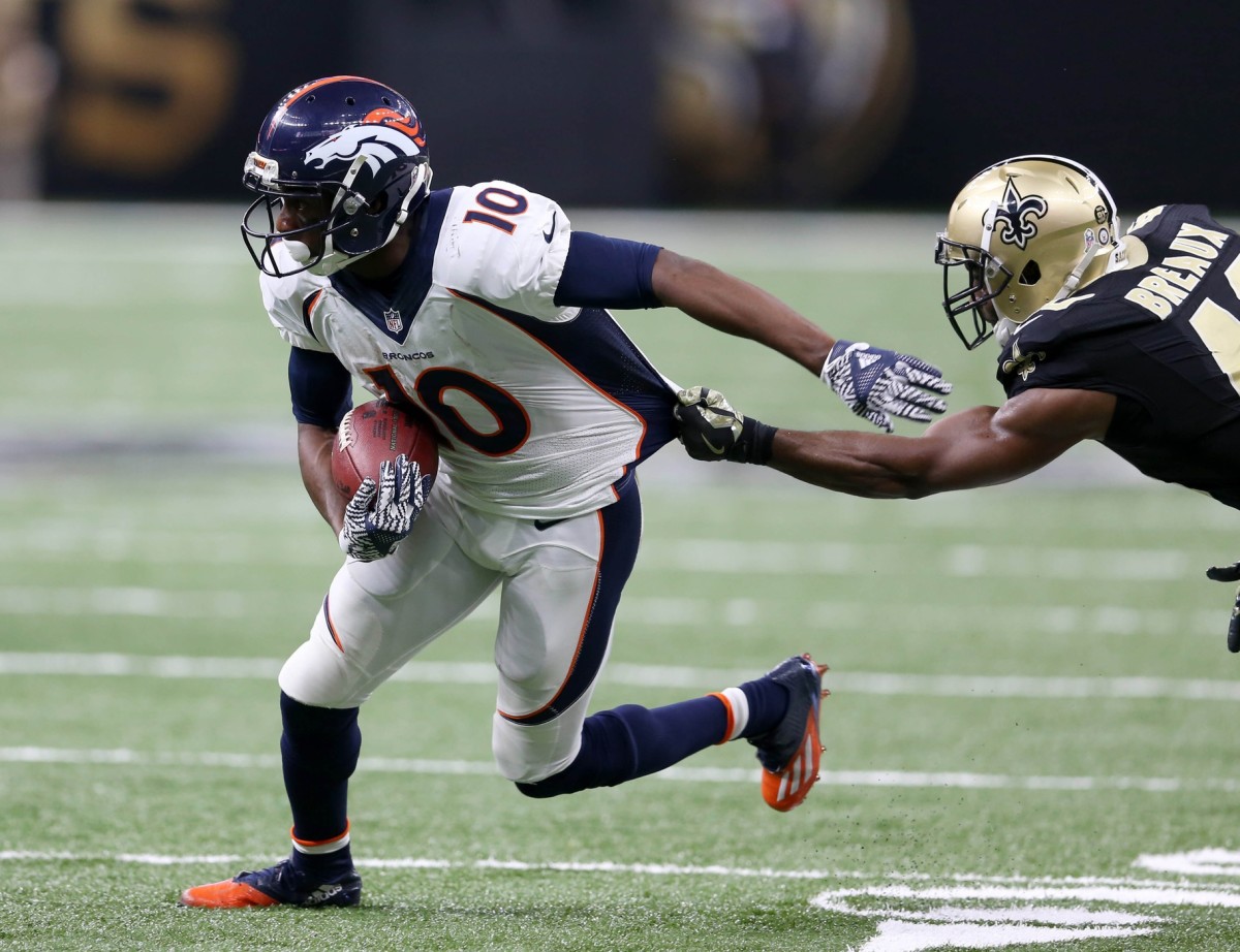 Nov 13, 2016; New Orleans, LA, USA; Denver Broncos wide receiver Emmanuel Sanders (10) makes a catch and is defended by New Orleans Saints cornerback Delvin Breaux (40) in the second half at the Mercedes-Benz Superdome. The Broncos won, 25-23. Mandatory Credit: Chuck Cook-USA TODAY Sports