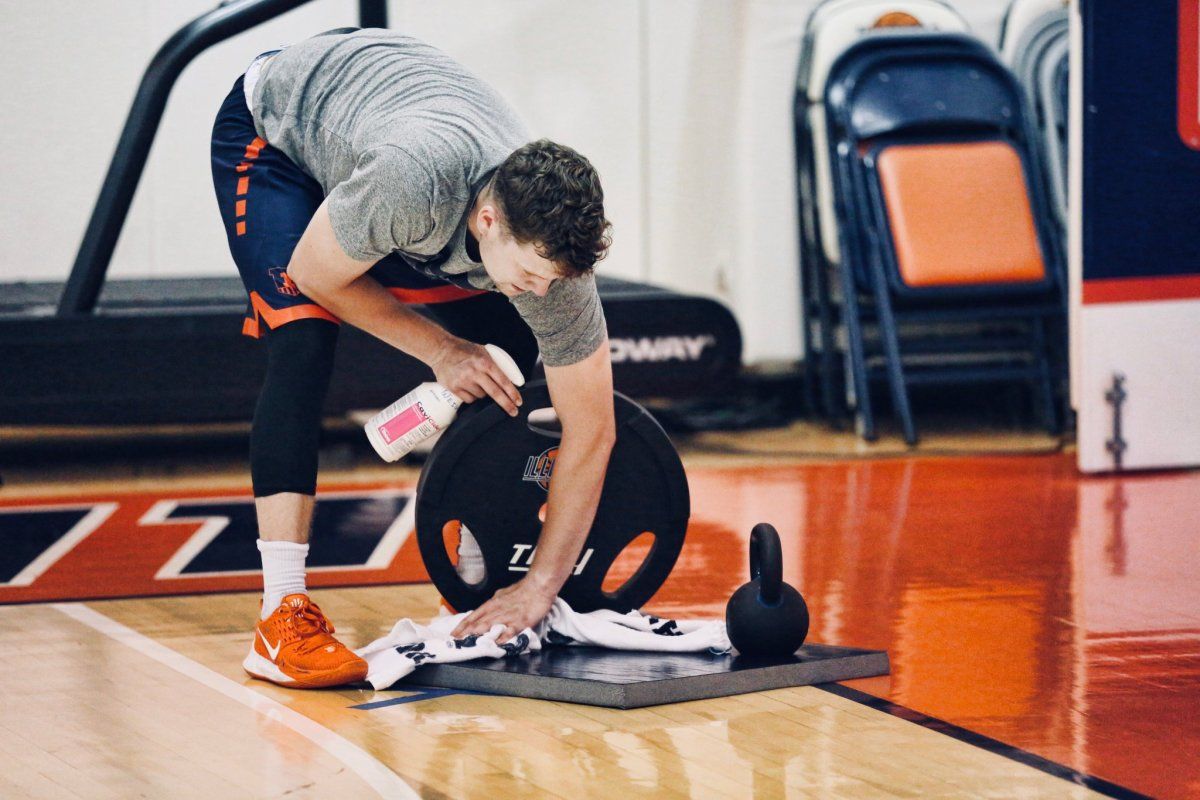 Tyler Underwood cleaning up a drill area Monday as players and coaches were able to conduct workouts for the first time this summer starting this week.