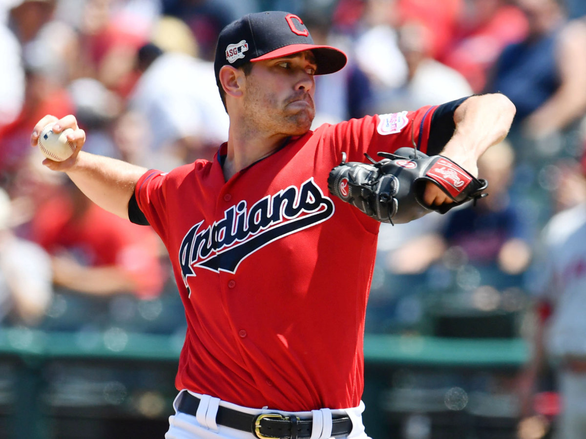 Shane Bieber throws a pitch