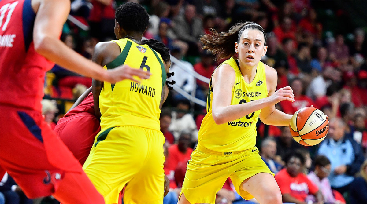 Breanna Stewart dribbles the ball
