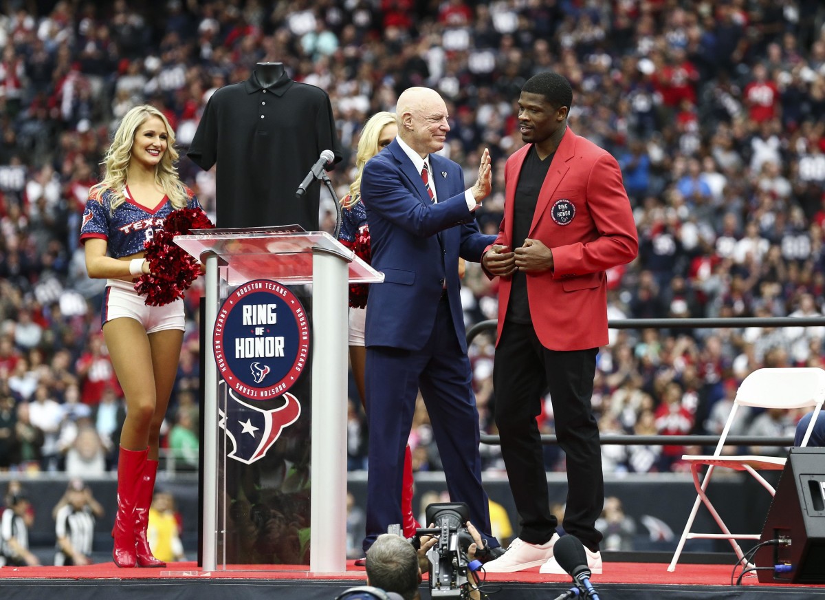 Former Texans wide receiver Andre Johnson (right) is inducted into the team's Ring of Honor by owner Bob McNair at halftime of a 2017 game against the Cardinals.