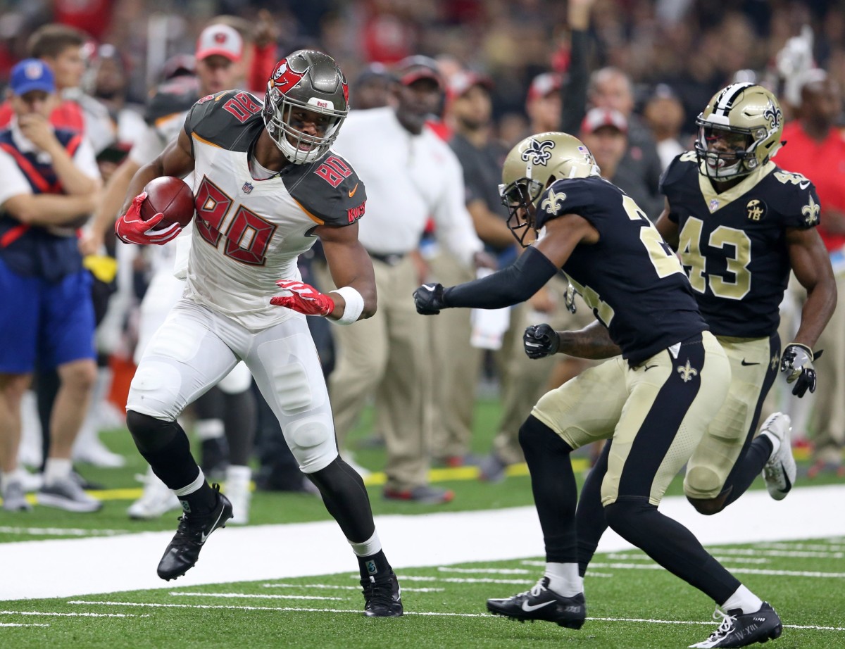 Sep 9, 2018; New Orleans, LA, USA; Tampa Bay Buccaneers tight end O.J. Howard (80) runs after a catch and is defended by New Orleans Saints defensive back Vonn Bell (24) in the second quarter at the Mercedes-Benz Superdome. Mandatory Credit: Chuck Cook-USA TODAY Sports