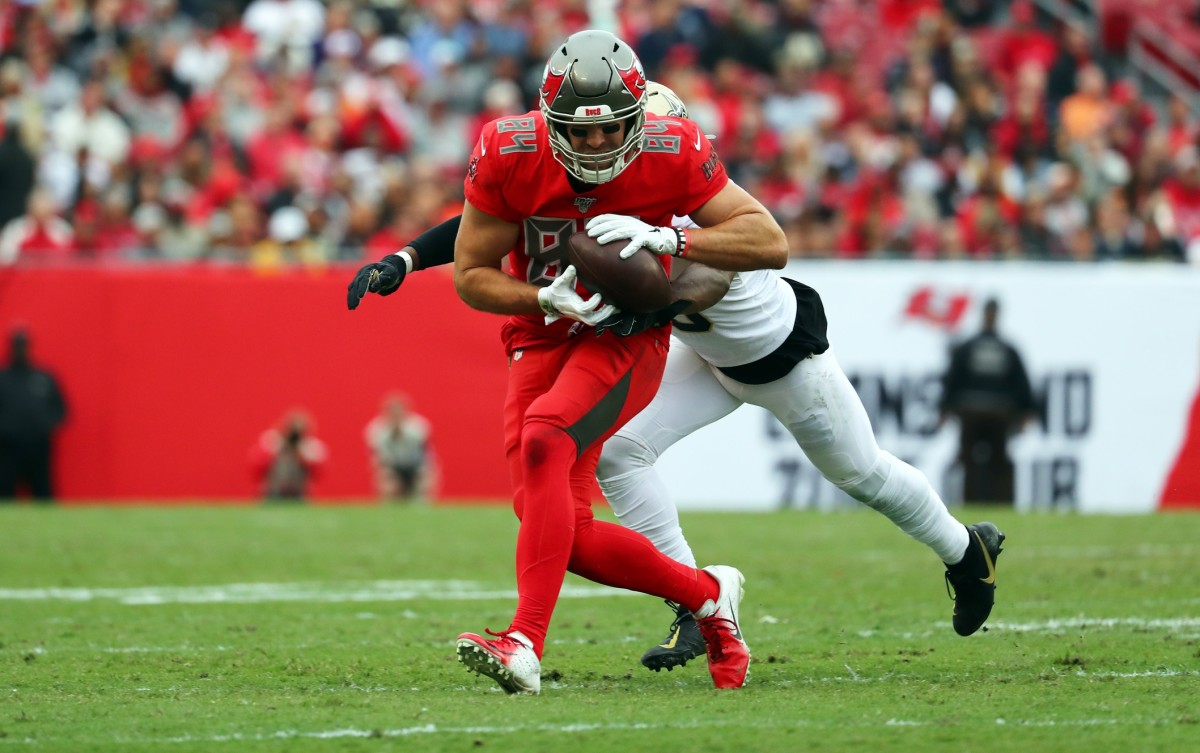 Nov 17, 2019; Tampa, FL, USA; Tampa Bay Buccaneers tight end Cameron Brate (84) catches the ball over New Orleans Saints cornerback Eli Apple (25) during the second half at Raymond James Stadium. Mandatory Credit: Kim Klement-USA TODAY Sports