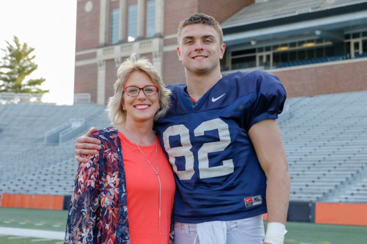 Luke Ford (pictured with his mother on his right), who was the best tight end prospect in the 2018 recruiting class and transferred from Georgia, will finally get a chance to play for Illinois this season. 