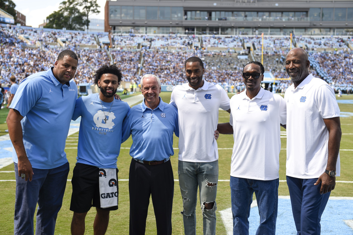 North Carolina basketball players were honored with their 2017 National Championship rings at halftime at Kenan Memorial Stadium. Pictured here are five Final Four MVPs with Roy Williams.