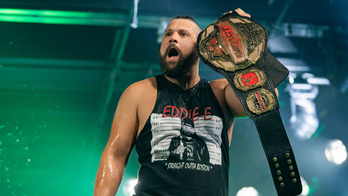 Eddie Edwards poses with the Impact World Championship