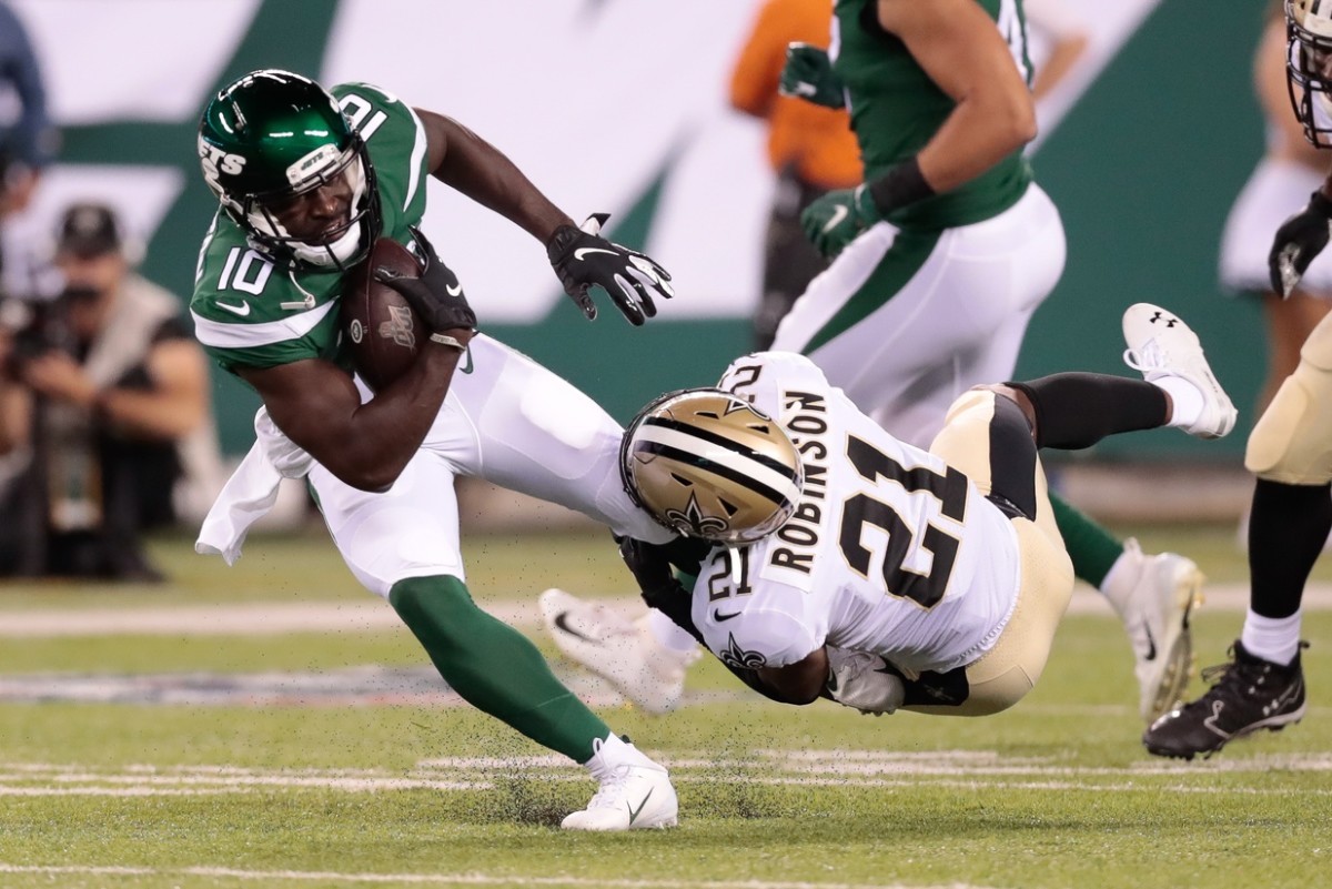 Aug 24, 2019; East Rutherford, NJ, USA; New York Jets wide receiver Deonte Thompson (10) is tackled by New Orleans Saints defensive back Patrick Robinson (21) during the second half at MetLife Stadium. Mandatory Credit: Vincent Carchietta-USA TODAY Sports