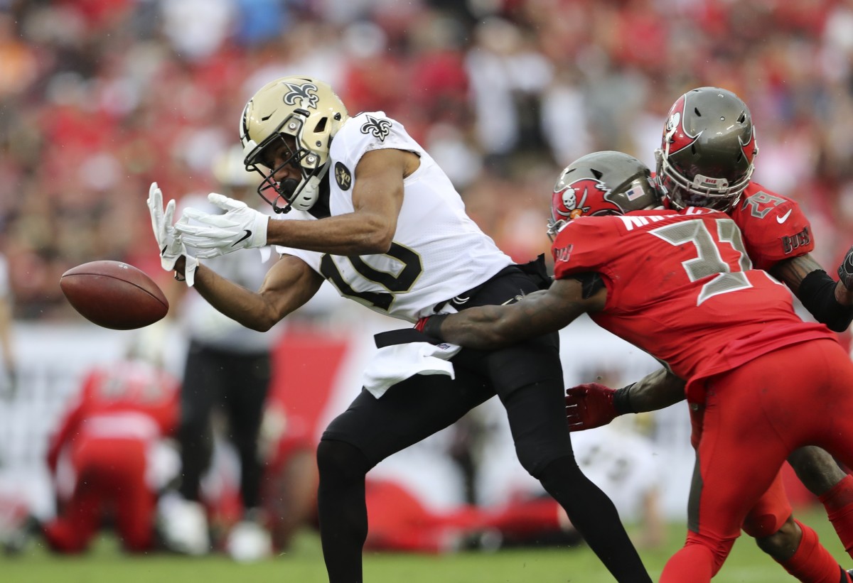 Dec 9, 2018; Tampa, FL, USA; Tampa Bay Buccaneers free safety Jordan Whitehead (31) knocks the ball away from New Orleans Saints wide receiver Tre'Quan Smith (10) during the second half at Raymond James Stadium. Mandatory Credit: Kevin Jairaj-USA TODAY Sports