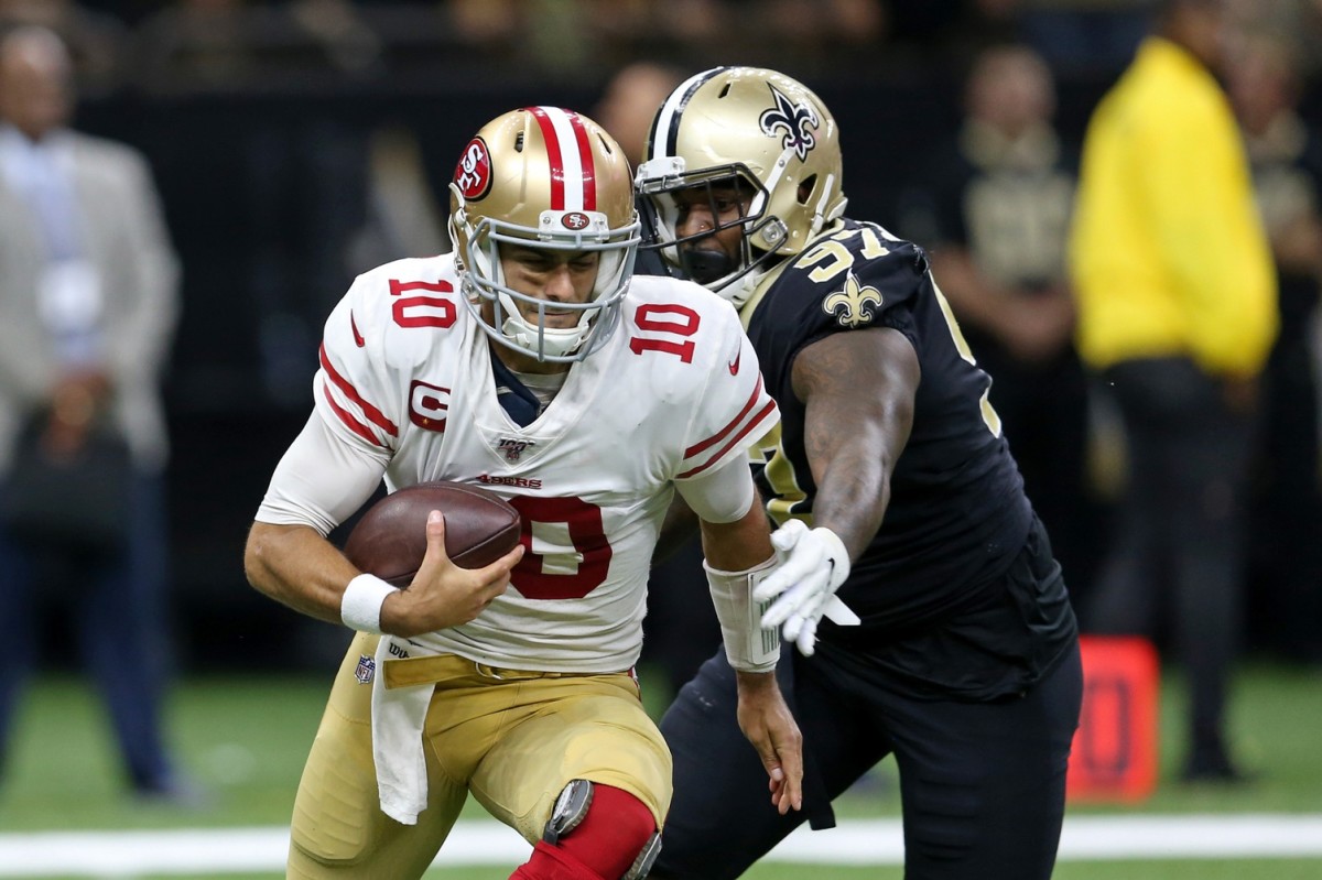Dec 8, 2019; New Orleans, LA, USA; San Francisco 49ers quarterback Jimmy Garoppolo (10) is sacked by New Orleans Saints defensive end Mario Edwards (97) in the second half at the Mercedes-Benz Superdome. The 49ers won, 48-46. Mandatory Credit: Chuck Cook-USA TODAY S