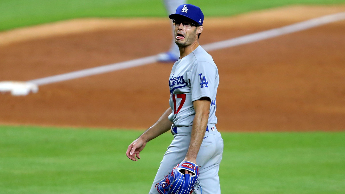 Jul 28, 2020; Houston, Texas, USA; Los Angeles Dodgers relief pitcher Joe Kelly (17) shouts at Houston Astros shortstop Carlos Correa (1, not shown) after a strikeout during the sixth inning at Minute Maid Park.