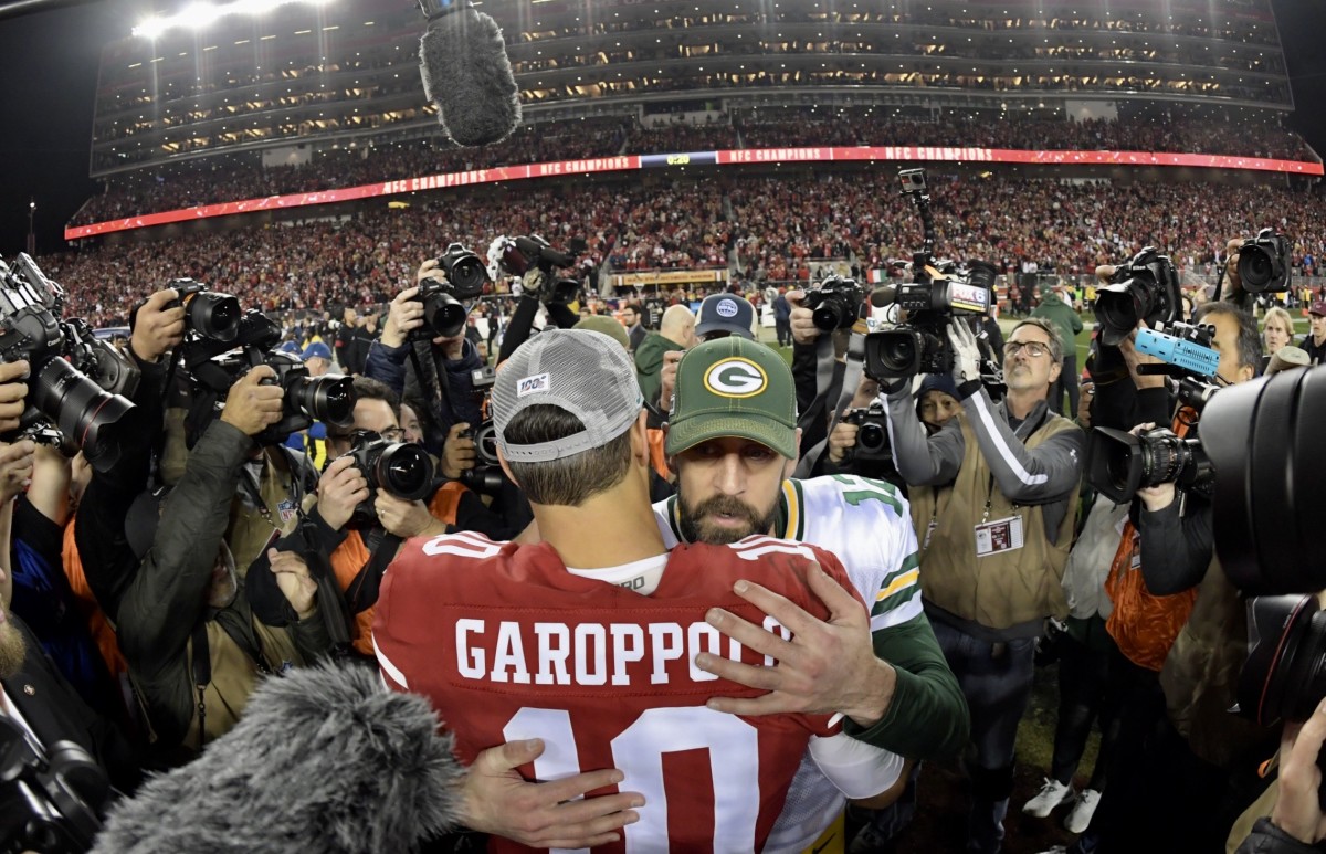 Aaron Rodgers embraces Jimmy Garoppolo after last year's NFL title game.