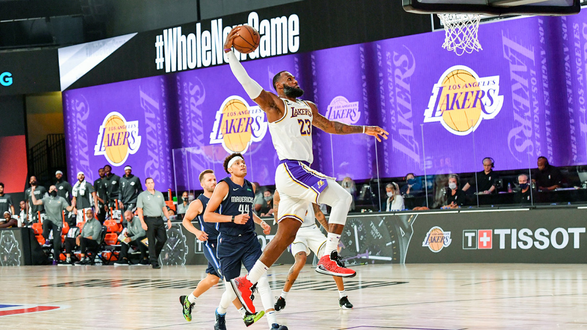 LeBron James of the Lakers dunks the ball