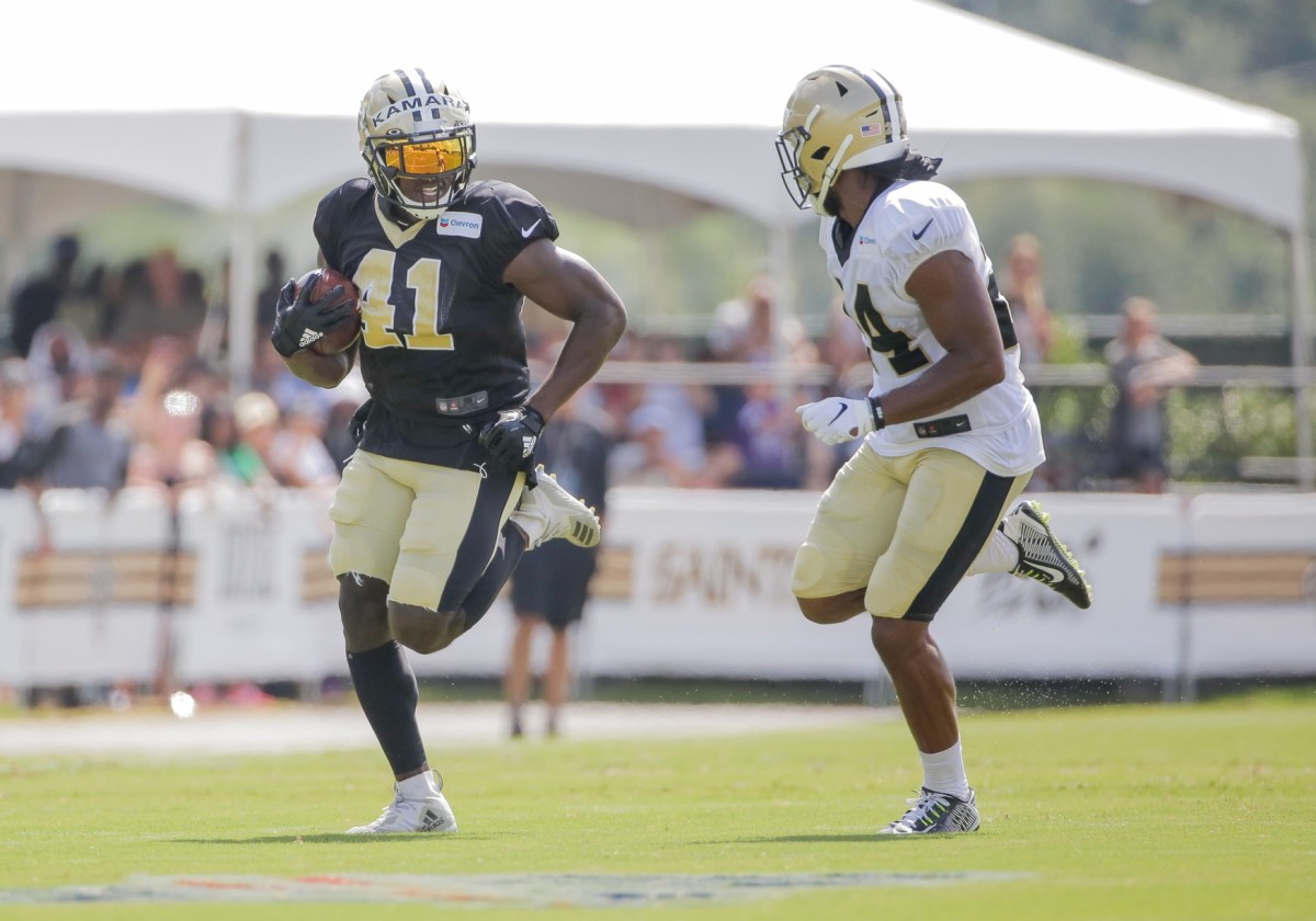Aug, 3, 2019; Metairie, LA, USA; \New Orleans Saints running back Alvin Kamara (41) runs past strong safety Vonn Bell (24) during training camp practice at the Ochsner Sports Performance Center. Mandatory Credit: Derick E. Hingle-USA TODAY Sports