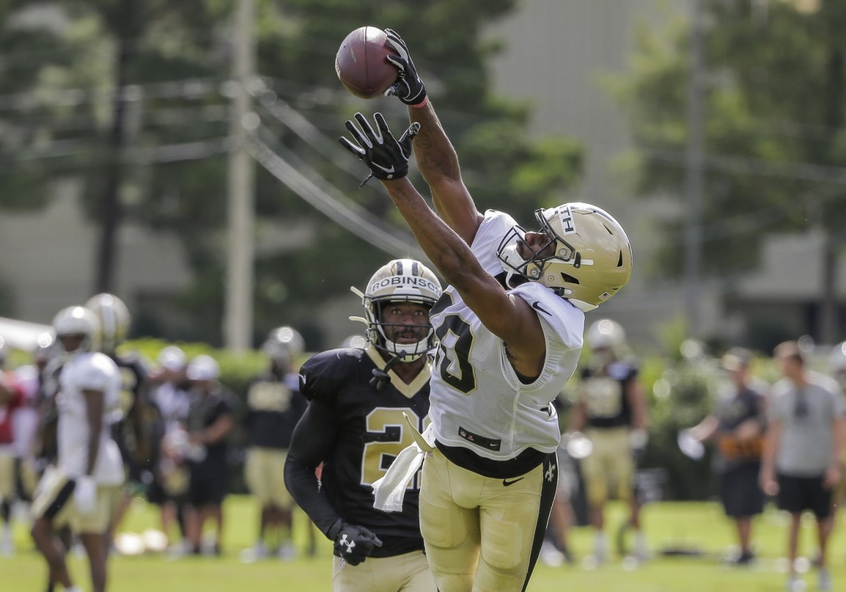 Jul 28, 2019; Metairie, LA, USA; New Orleans Saints wide receiver Tre'Quan Smith (10) catches a pass over defensive back Patrick Robinson (21) during training camp at the Ochsner Sports Performance Center. Mandatory Credit: Derick E. Hingle-USA TODAY 