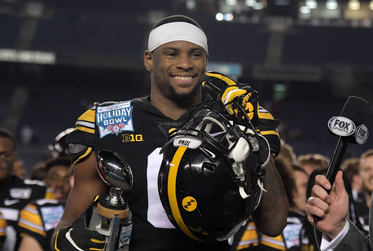 Iowa Hawkeyes wide receiver Ihmir Smith-Marsette (6) holds the most valuable offensive player trophy during the Holiday Bowl against the Southern California Trojans at SDCCU Stadium.