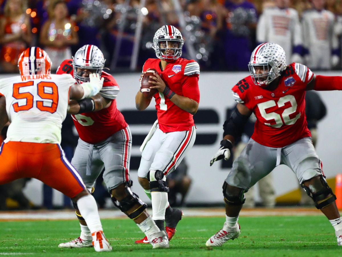 Ohio State Buckeyes quarterback Justin Fields (1) throws in the pocket against the Clemson Tigers in the 2019 Fiesta Bowl college football playoff semifinal game.
