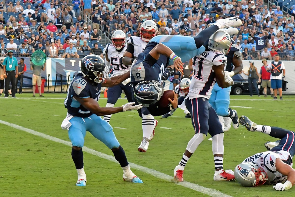 Tennessee Titans quarterback Marcus Mariota (8) dives into the end zone for the two point conversion against the New England Patriots prior to the game at Nissan Stadium.