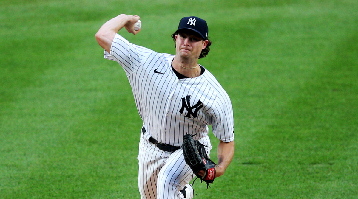 Aug 3, 2020; Bronx, New York, USA; New York Yankees starting pitcher Gerrit Cole (45) pitches against the Philadelphia Phillies during the first inning at Yankee Stadium.